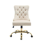 side view of beige velvet desk chair featuring gold tone metal support base
