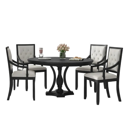 black and oak round dining table set with four matching chairs arranged in dining room interior