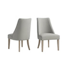 light grey upholstered dining chair set with reclaimed wood legs positioned beside dining table