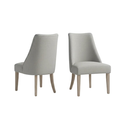 light grey upholstered dining chair set with reclaimed wood legs positioned beside dining table