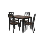 rectangular wood dining table paired with four slat back dining chairs for indoor use