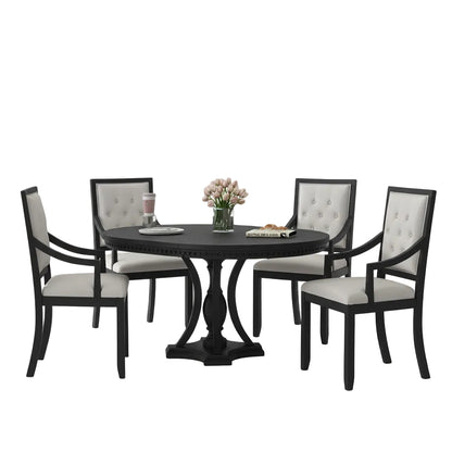 round dining room table with black support structure and oak finish tabletop surface