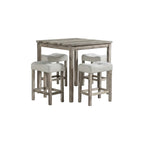 square bar height dining table with chairs stored neatly underneath for compact space arrangement